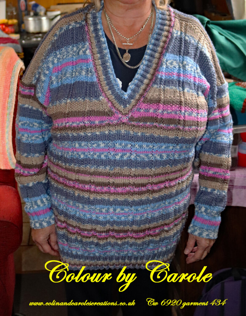 A V neck jumper hand knitted aboard the narrow boat “Emma Maye” in Lancashire by Carole Wareing of Colin and Carole’s Creations. Created from a shade of “Fairground” from J C Brett’s (shade no G11) which is an acrylic yarn. Colours are shades of pink, blues and fawn’s. A randomly striped jumper, unique, garment.