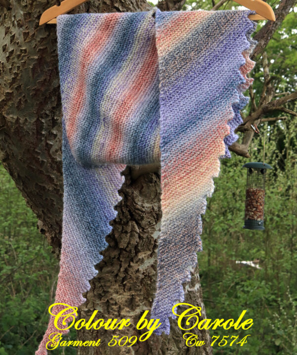 A pastel shades Dragon tooth shawl hand knitted aboard the narrow boat “Emma Maye” in Lancashire by Carole Wareing of Colin and Carole’s Creations. This unique garment is an adult sized shawl knitted from Marble yarn. This unique garment will make a great handmade hug for someone you can’t actually hug at the moment, or Christmas or Birthday present or for wearing in a pub garden.