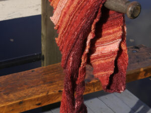 A Dragon tooth scarf hand knitted aboard the narrow boat “Emma Maye” in Lancashire by Carole Wareing of Colin and Carole’s Creations. This unique garment is an adult sized scarf, knitted from a discontinued yarn. The garment is created from a yarn with shades of bronze, gold’s and browns The yarn is a wool and acrylic mix, 80% Premium Acrylic / 20% Wool mix so very warm and snuggly. The shawl is 68 inch long and 12 inch wide at its widest point and has about 64 dragon’s teeth. Price £20 includes free delivery to a UK address, please enquire for overseas delivery Garment 539 Cw 7779