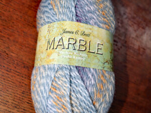 J C Bretts Marble double knitting yarn shade MT52 in fawn and grey shades.
