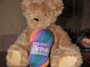 Aurora DK Yarn Available in a range of 14 shades, this being shade AU 01 Shades of oranges and purples. Can be posted out to a uk address with postage if applicable From James C Brett and The Wool Boat