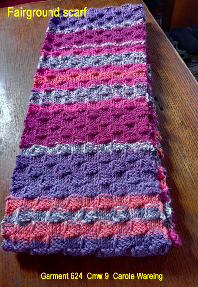 A striped scarf was hand knitted aboard the narrow boat “Emma Maye” in Lancashire by Carole Wareing of Colin and Carole’s Creations. Great for a adult or teenager, Created from a shade G15 from J C Brett’s “Fairground” range. Colour – Purple, Orange, grey, magenta in horizontal stripes of varying depths. Width 7.5 inches Length 70 inches long Machine washable at 30 degrees C The price is £20 including delivery to a uk address, or come and pick up from The Wool Boat. Garment 624 Garment 624 Cmw 9 Carole Wareing