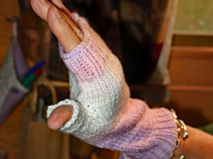 Pastel pink, lilac and white Magi knit fingerless mittens A pair of fingerless mittens designed and hand knitted by Carole Wareing of Colin and Carole’s Creations and The Wool Boat. These are adult sized mittens ideal for gardening, typing, mechanicing, IT work, locking, bicycling, photography… The gloves are for sale for £7.50 or £11 including delivery to UK address. They are knitted from J C Bretts Magi Knit double knitting acrylic yarn shade 2135 which is in shades of Pastel pink, lilac and white. We stock this yarn on board the Wool Boat along with further Magi knit shades which knits to most double knitting patterns. Copyright Colin Wareing Cw 8503 garment 619 Garment 619 Cw 8503 Hand knitted by Carole Wareing Garment 619 Cw 8503
