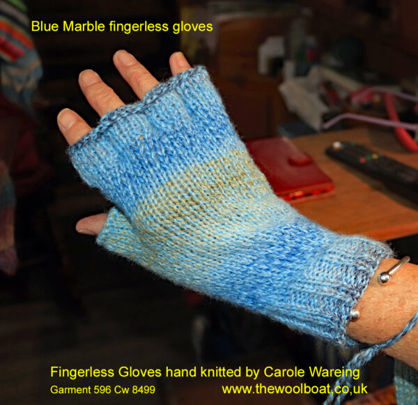 A pair of blue and wheat fingerless gloves designed and hand knitted by Carole Wareing of Colin and Carole’s Creations and The Wool Boat. These are adult sized gloves ideal for gardening, typing, mechanicing, It work, locking, bicycling.... The gloves are for sale for £7.50 or £11.00 including delivery to a uk address They are knitted from J C Bretts Marble double knitting acrylic yarn Shade MT2.