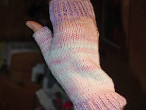 Pastel pink, lilac and white Magi knit fingerless mittens A pair of fingerless mittens designed and hand knitted by Carole Wareing of Colin and Carole’s Creations and The Wool Boat. These are adult sized mittens ideal for gardening, typing, mechanicing, IT work, locking, bicycling.... The gloves are for sale for £7.50 or £11 including delivery to UK address. They are knitted from J C Bretts Magi Knit double knitting acrylic yarn shade 2135 which is in shades of Pastel pink, lilac and white. We stock this yarn on board the Wool Boat along with further Magi knit shades which knits to most double knitting patterns. Copyright Colin Wareing Cw 8500 garment 615