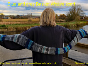 Blue and grey Basket Weave scarf An adult sized scarf hand knitted by Carole Wareing from Colin and Carole's Creations. The scarf has a basket weave pattern knitted into the final 9 inches, at either end, whilst the yarn produces a natural striped pattern. The colours are light blues, dark blues and greys. The scarf is approx 64 inch/ 163 cm long and 6inch/15cm wide until the last 9 inches / 23cm on either end of the scarf where the basket weave pattern is and the scarf widens out to 8 inches/21cm The price is £20 including free postage to a uk address, or come and pick up from The Wool Boat. The yarn used for this scarf is an acrylic yarn from the James C Brett’s “Fairground” range, shade G9. The Wool Boat’s virtual mooring if you can’t get to us on a canal is www.thewoolboat.co.uk or Carole can be contacted on 07931 356204