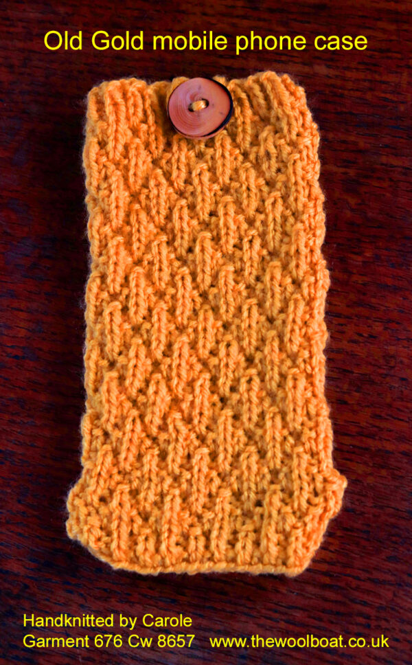 Old Gold mobile phone case. A deep yellow mobile phone case hand knitted aboard the narrow boat “Emma Maye” in Lancashire by Carole Wareing of Colin and Carole’s Creations. This phone case is 6.5 inches/16cm long by 3.5 inches/7.5cm which suits a good range of mobile phones or a right sized one could be designed for your phone. The yarn, “Top Value” is produced by James C Brett and this is shade no TV 8462 which we call “Old Gold” Can be knitted in any of the 32 shades we have in stock. The yarn is an acrylic one, so easy care.