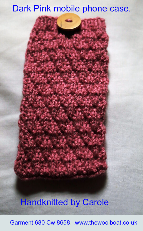 A dark pink mobile phone case hand knitted aboard the narrow boat “Emma Maye” in Lancashire by Carole Wareing of Colin and Carole’s Creations. This phone case is 6.5 inches/16cm long by 3.5 inches/7.5cm which suits a good range of mobile phones or a right sized one could be designed for your phone. The yarn, “Top Value” is produced by James C Brett and this is shade no TV 8422 which we call “Dark Pink” Can be knitted in any of the 32 shades we have in stock. The yarn is an acrylic one, so easy care. Price is £8 picked up from The Wool Boat or including delivery to a UK address is £10.50. Handknitted by Carole