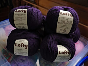 Wooly knits Lofty Chunky yarn, Shade Blackberry, a nice deep purple. Machine Washable 80% Supersoft Merino Wool 20% Nylon 100-gram balls, 6 mm needles, 104 meters / 116 yards knits to most Chunky patterns. £5 per 100-gram ball. Can be posted out to a uk address. £30 for all six balls