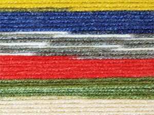 Fairground DK premium acrylic yarn Available in range of self-patterning shades. This is shade G14 in shades of Red, yellow and green.