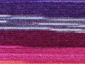 Fairground DK premium acrylic yarn Available in range of self-patterning shades. This is shade G15 in shades of Red, lilac and cream.