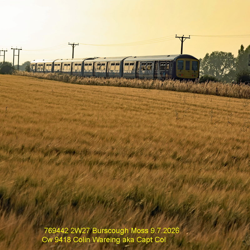 769442 2W27 Burscough Moss 9.7.2026
One of Northern’s flexi units’ heads into the sun set after passing the pedestrian foot crossing between the level crossing at Crabtree Lane and the station at New Lane and in West Lancashire on a warm Thursday evening in July 2026.
It is providing the 18.52 service from Stalybridge to Southport under headcode, or train reporting no 2W27.
Burscough Moss 9.7.2026
Photo image Cw 9418 Copyright Colin Wareing